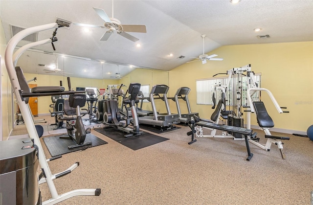 gym featuring ceiling fan, a textured ceiling, and vaulted ceiling