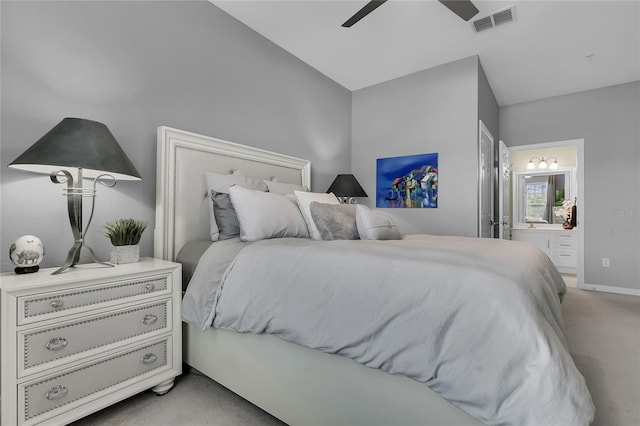 carpeted bedroom featuring ensuite bathroom and ceiling fan