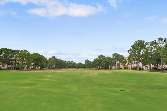 surrounding community featuring a lawn