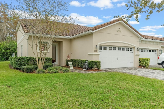 view of front of house featuring a garage and a front lawn