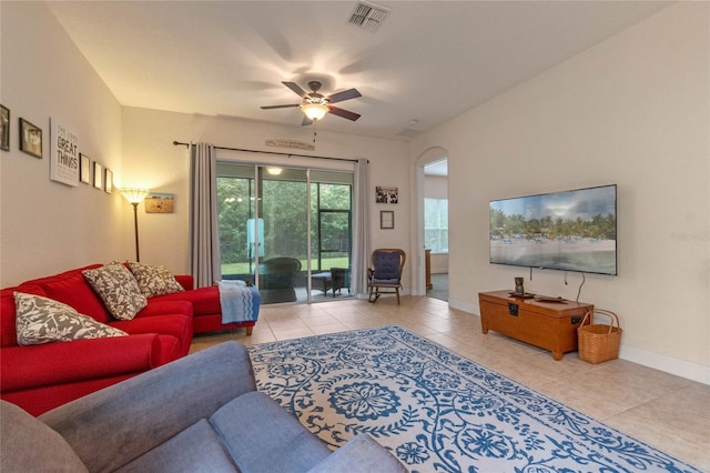 tiled living room with ceiling fan