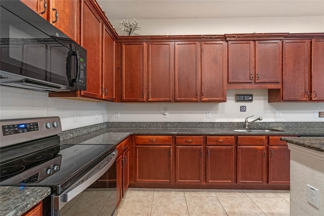 kitchen with stainless steel electric stove, dark stone countertops, sink, and light tile patterned flooring