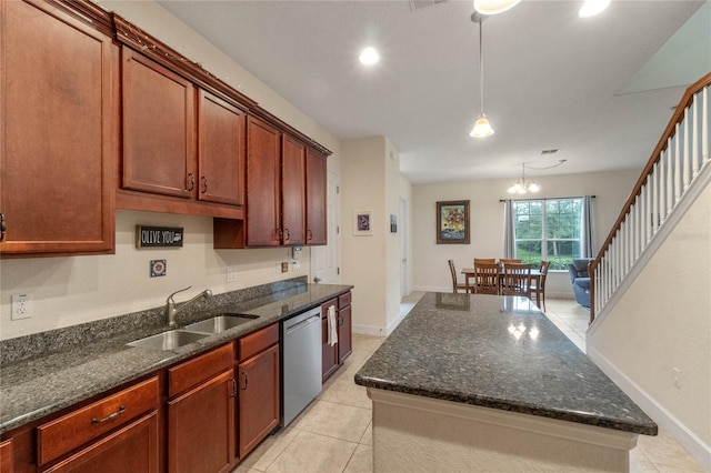 kitchen featuring pendant lighting, dishwasher, sink, light tile patterned floors, and a chandelier