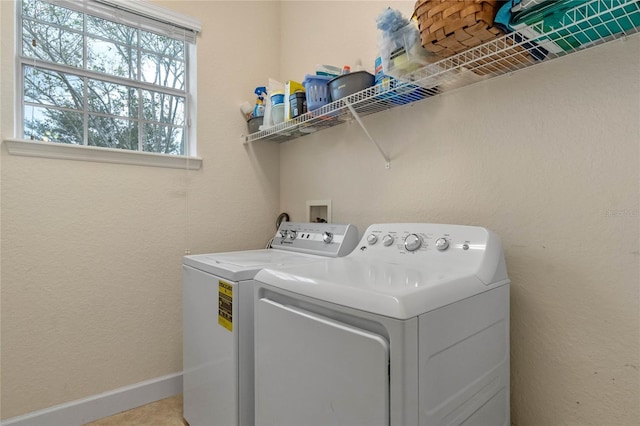 washroom with washer and dryer