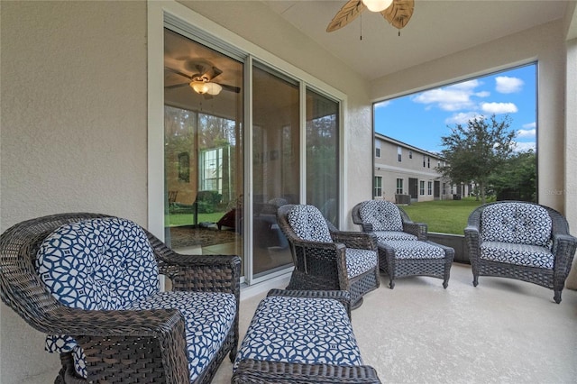 sunroom with ceiling fan