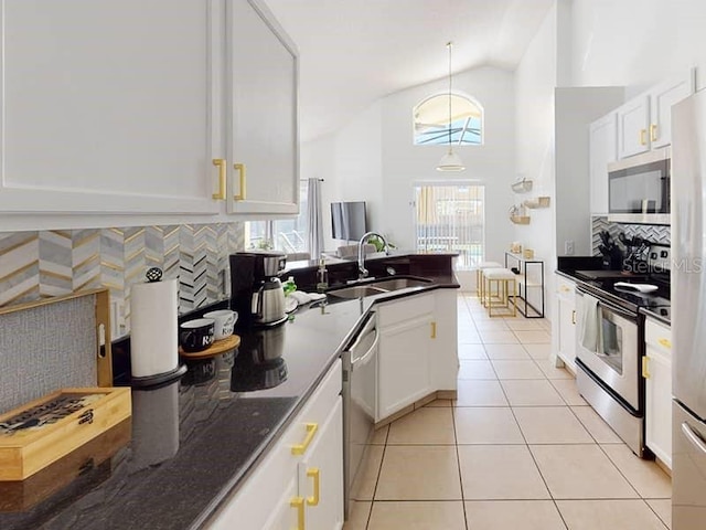 kitchen featuring white cabinets, appliances with stainless steel finishes, and sink