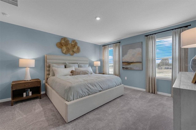 bedroom featuring light colored carpet