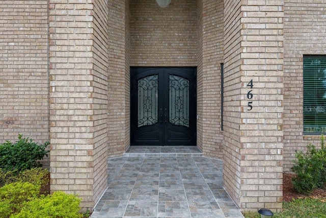 view of exterior entry featuring french doors