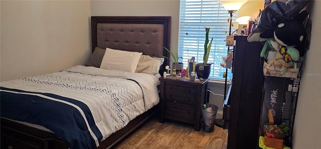 bedroom featuring hardwood / wood-style flooring