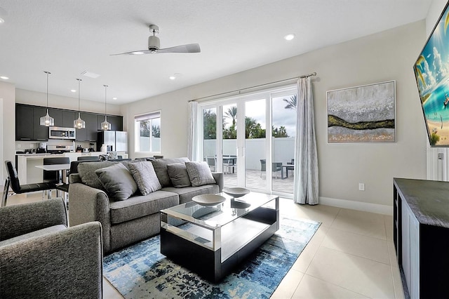 tiled living room with ceiling fan