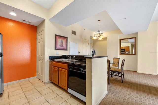 kitchen featuring dishwasher, sink, decorative light fixtures, light colored carpet, and a chandelier