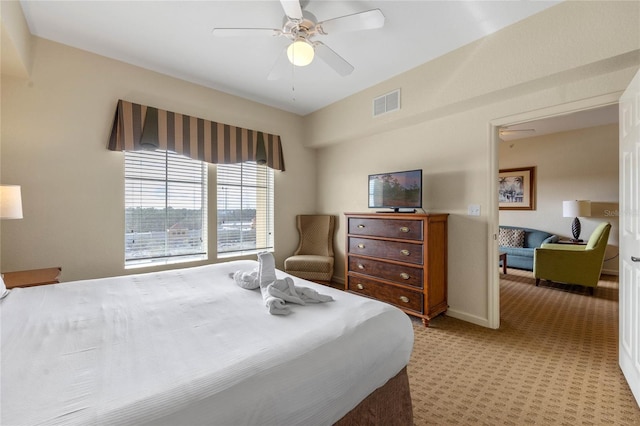 carpeted bedroom featuring ceiling fan