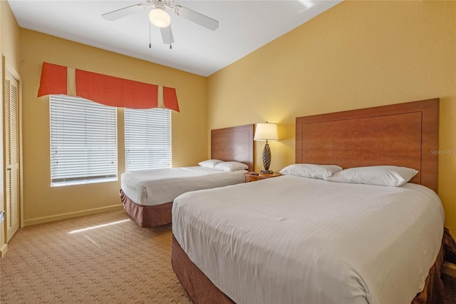 bedroom featuring carpet floors, a closet, and ceiling fan