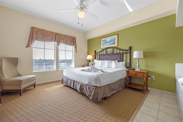 bedroom with ceiling fan and light tile patterned floors