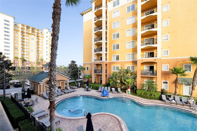 view of swimming pool with a patio