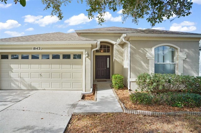 view of front of property with a garage