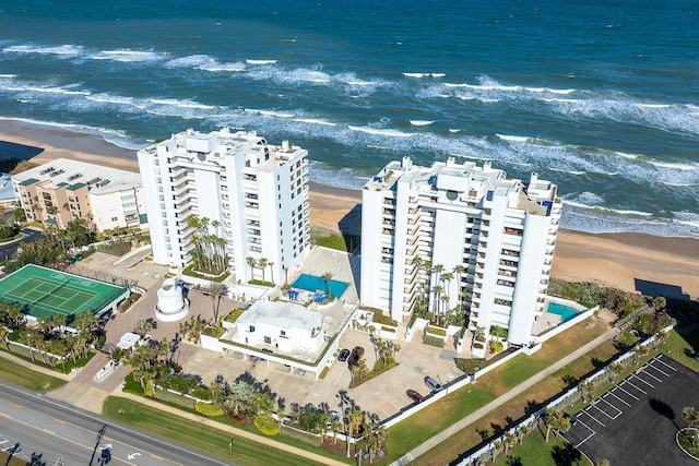 bird's eye view with a water view and a view of the beach