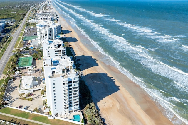 drone / aerial view with a view of the beach and a water view