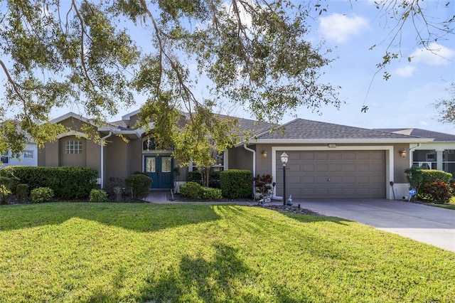 ranch-style home with a garage and a front lawn