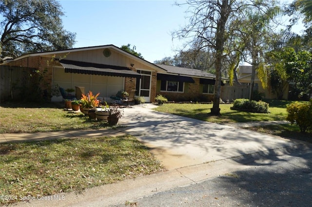 ranch-style house with a front lawn