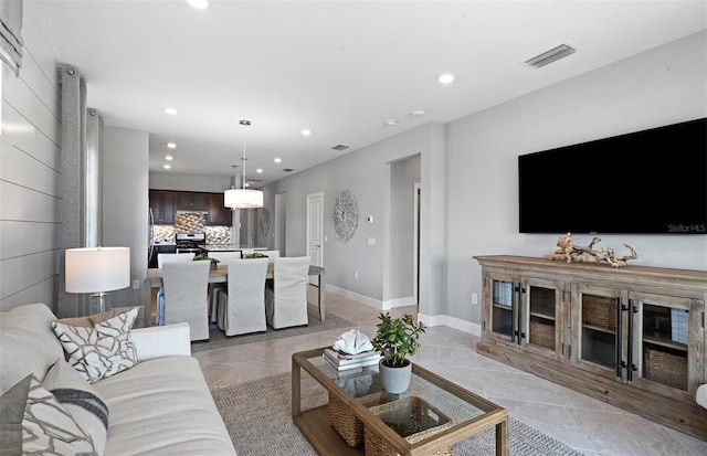 living room with light tile patterned floors