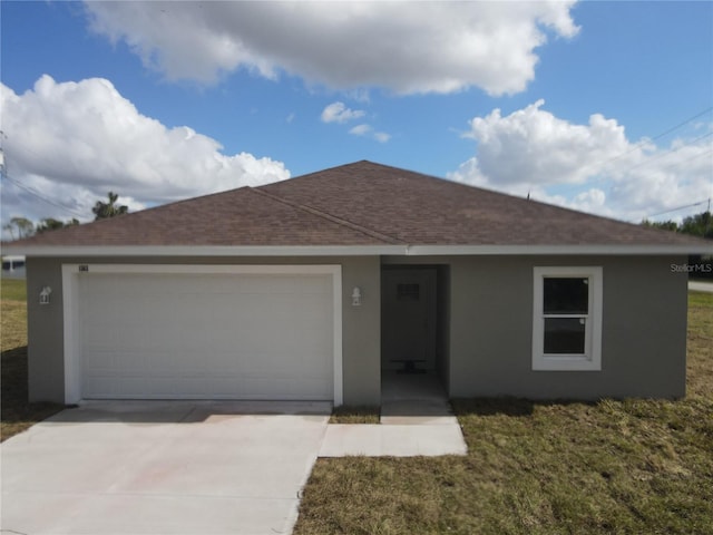 single story home with driveway, roof with shingles, an attached garage, a front lawn, and stucco siding