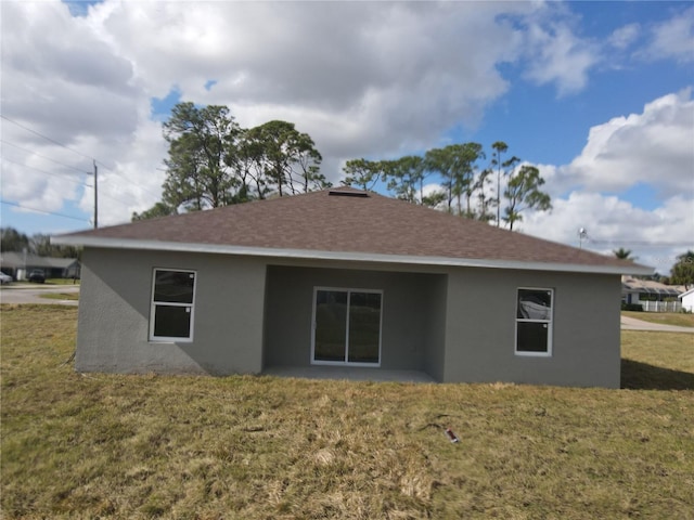 view of side of property featuring a yard