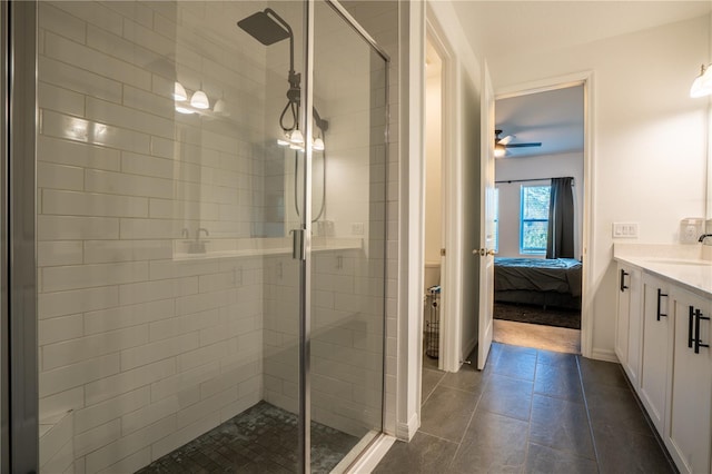 bathroom featuring ceiling fan, tile patterned flooring, vanity, and a shower with shower door