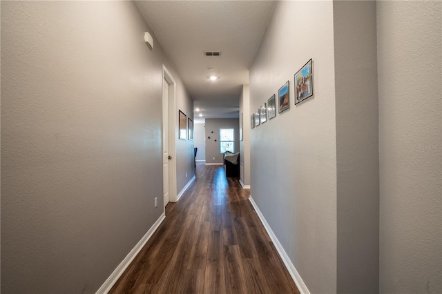 hallway featuring dark hardwood / wood-style floors