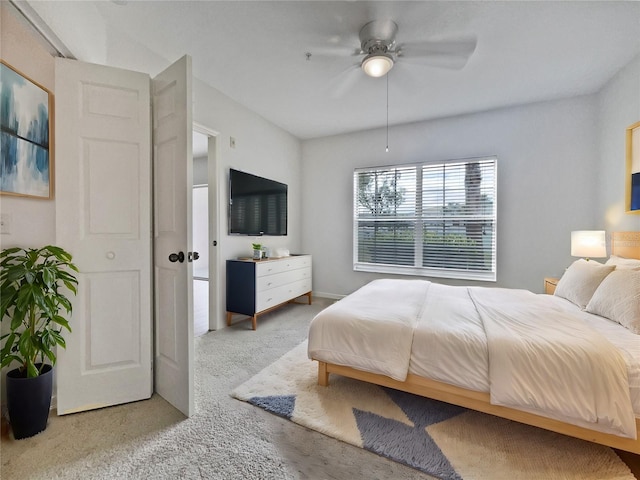 bedroom with ceiling fan and carpet floors