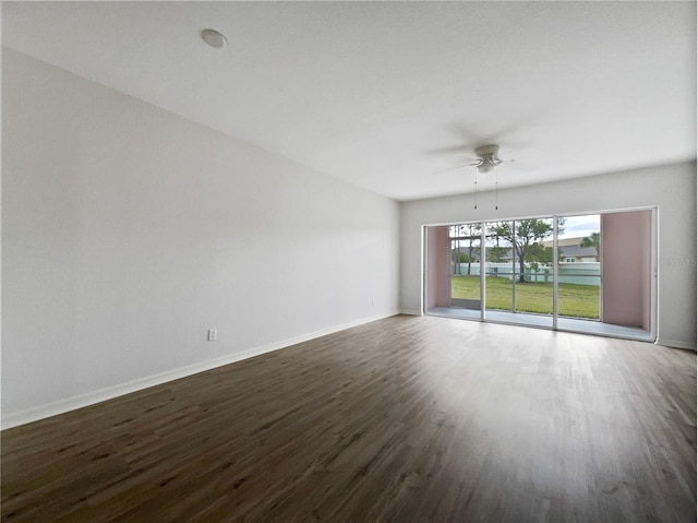 empty room featuring ceiling fan and dark hardwood / wood-style floors