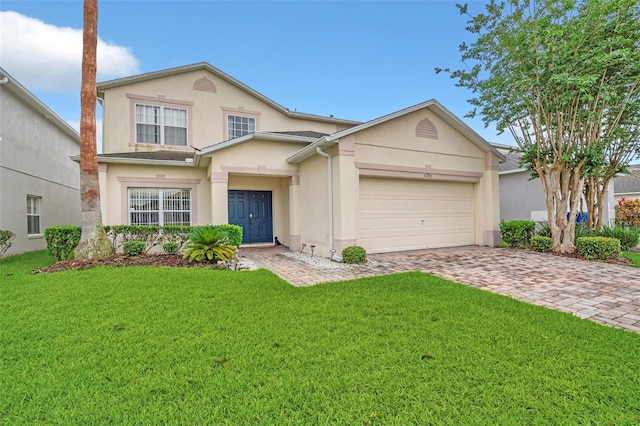 front facade featuring a garage and a front yard