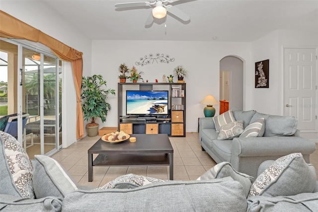 living room with ceiling fan and light tile patterned floors