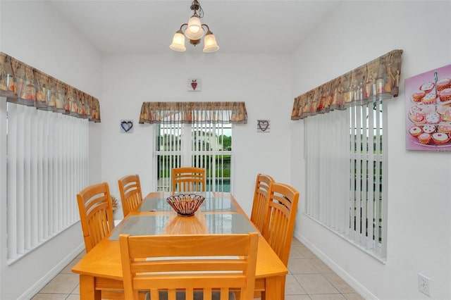 dining space featuring light tile patterned flooring