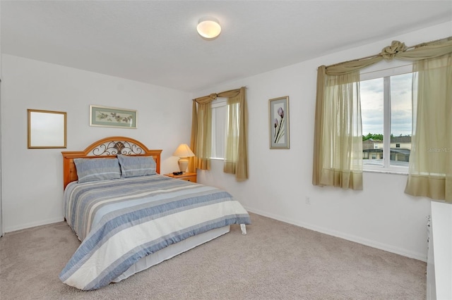 bedroom with light colored carpet