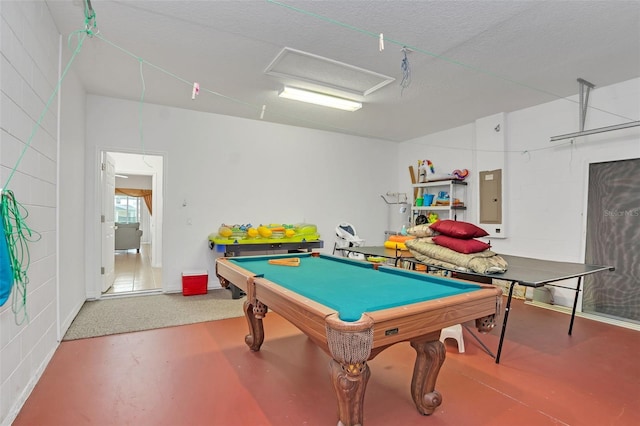 game room featuring billiards, a textured ceiling, electric panel, and concrete flooring