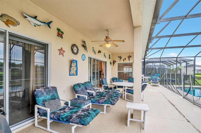 view of patio / terrace with glass enclosure and ceiling fan