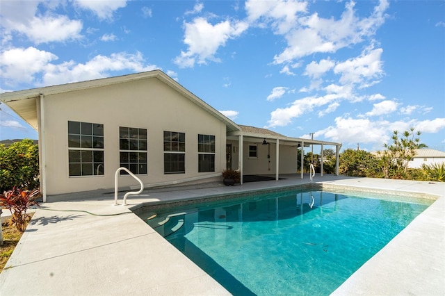 view of pool featuring a patio and ceiling fan