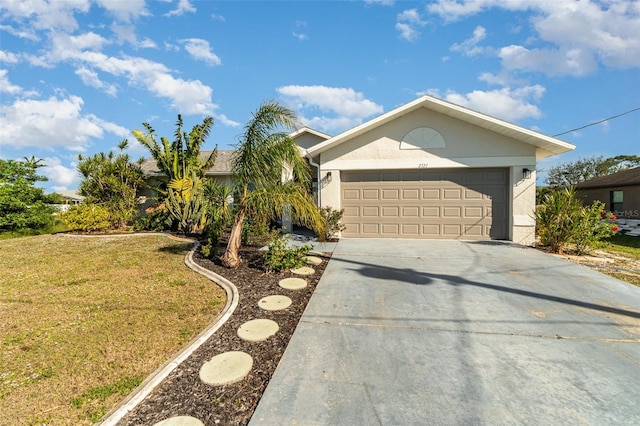 view of front facade with a garage and a front lawn