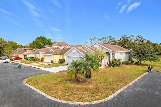 view of front facade featuring a front lawn and a garage