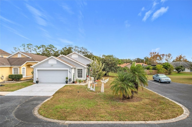 view of front of house with a garage and a front lawn