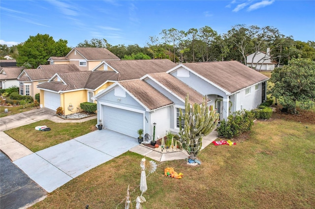 view of front of house featuring a front yard and a garage