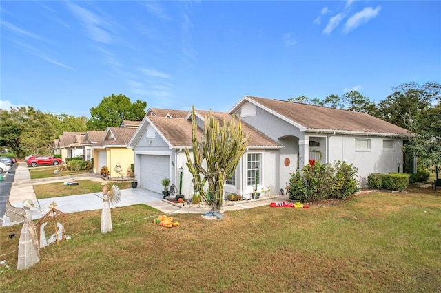 view of front of property featuring a garage and a front yard