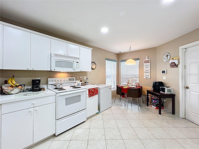 kitchen with white cabinetry, light tile patterned flooring, white appliances, and hanging light fixtures