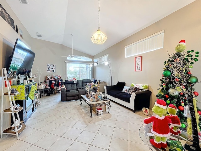 tiled living room featuring ceiling fan and vaulted ceiling