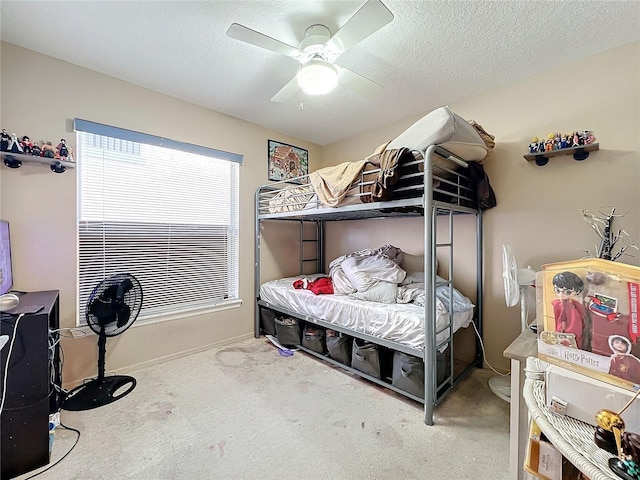 bedroom featuring a textured ceiling and ceiling fan