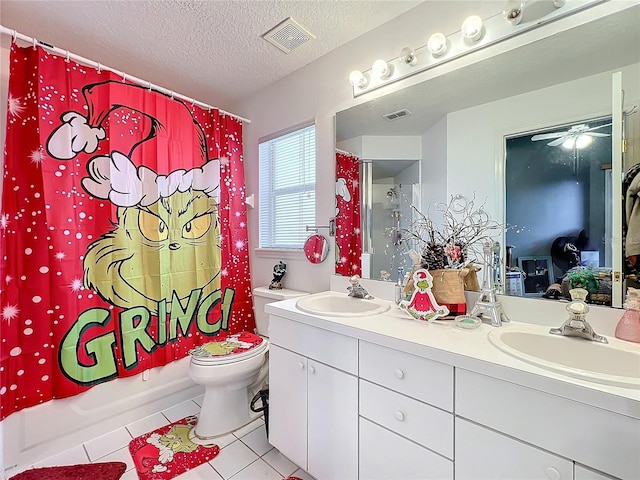 full bathroom featuring shower / bath combo, vanity, tile patterned floors, toilet, and a textured ceiling