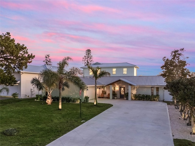 view of front of house with a yard