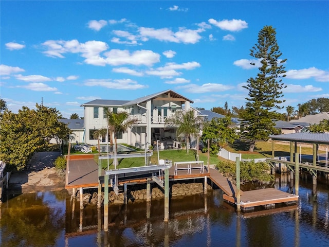 view of dock featuring a balcony and a water view