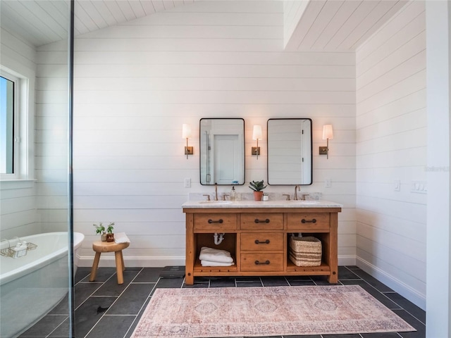 bathroom featuring a bathtub, wood walls, and vaulted ceiling